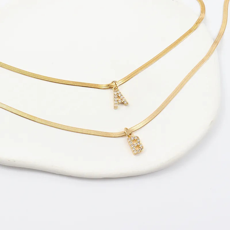 Collana a spina di pesce Melly® con iniziale e zirconi (Set)